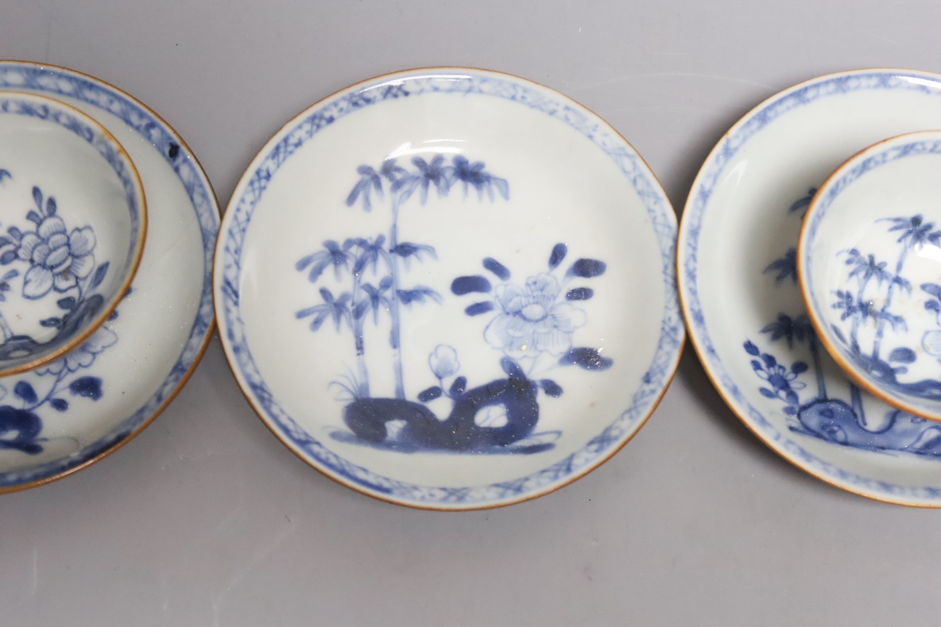 A set of four Chinese Nanking Cargo blue and white teabowls and saucers, with cafe au lait ground